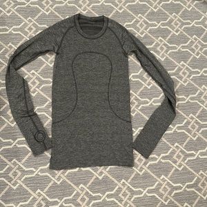 Almost new long sleeve silver with a hint of sparkle Lulu lemon Swifty top.